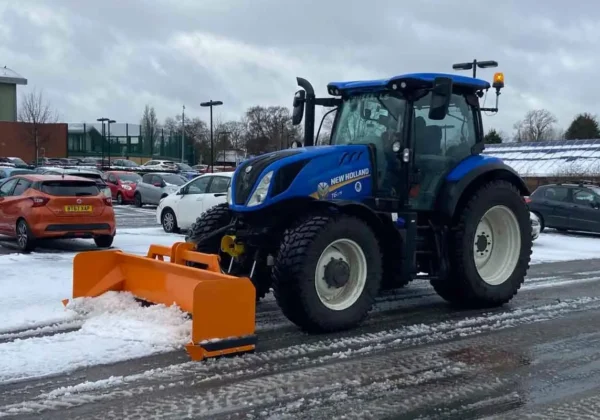 An image of Total Gritting Solutions Tractor doing snow clearance An image of Total Gritting Solutions Tractor doing snow clearance