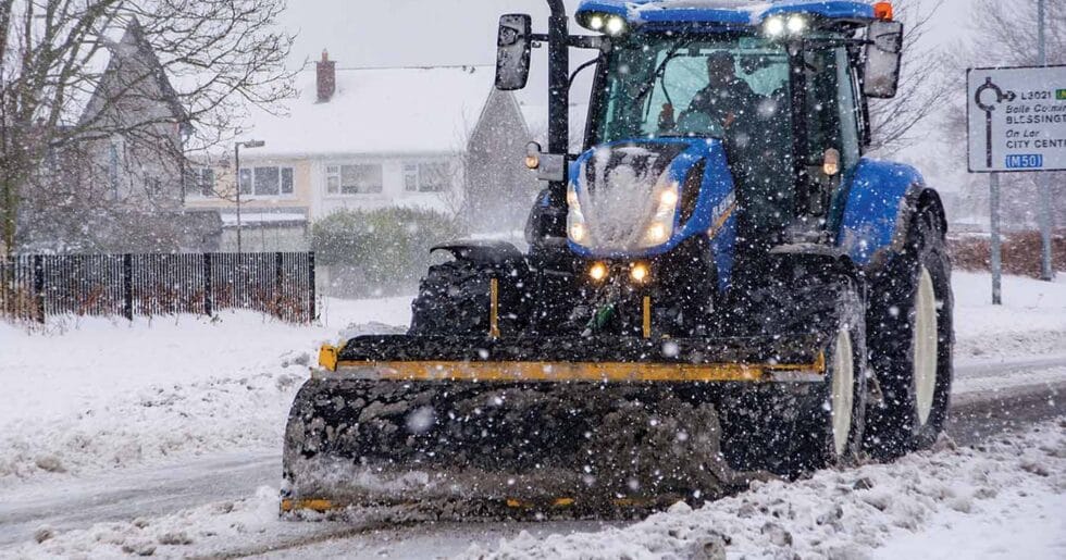 An image of Total Gritting Solutions tractor snow plough out doing snow clearance